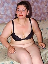 Brunette Fat Girl Teasing and Undressing Stockings
